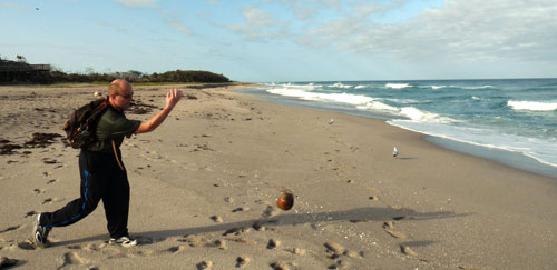 Doug bowling with coconuts